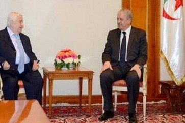 رئيس الوزراء الجزائري عبد المالك سلال ووزير الخارجية السوري وليد المعلم