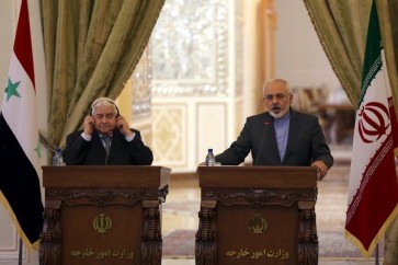وزيرا الخارجية الإيراني محمد جواد ظريف والسوري وليد المعلم (أرشيف)