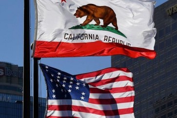 The California State flag flies beside a sign for its sister city Split outside City Hall, in Los Angeles, California on January 27, 2017.
A campaign by Californians to secede from the rest of the country over Donald Trump's election is gaining steam with suporters given the green light to start collecting signatures for the measure to be put to a vote./ AFP / Mark RALSTON        (Photo credit should read MARK RALSTON/AFP/Getty Images)