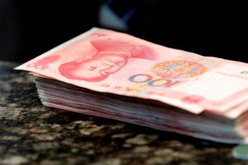 أوراق نقدية من فئة المئة يوان الصيني - أرشيف رويترز.
