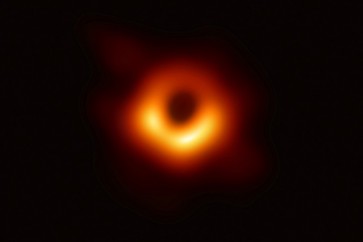 The first ever photo a black hole, taken using a global network of telescopes, conducted by the Event Horizon Telescope (EHT) project, to gain insight into celestial objects with gravitational fields so strong no matter or light can escape, is shown in this handout photo released April 10, 2019.  Event Horizon Telescope (EHT)/National Science Foundation/Handout via REUTERS   ATTENTION EDITORS - THIS IMAGE WAS PROVIDED BY A THIRD PARTY.  NO RESALES. NO ARCHIVE.