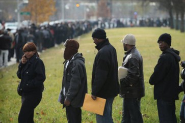 CHICAGO, IL - NOVEMBER 09:  Job seekers wait in line at Kennedy-King College to attend a job fair hosted by the city of Chicago on November 9, 2012 in Chicago, Illinois. Thousands of people started to line up at 3AM for the job fair which did not begin until 9AM. When the doors opened the line was about a half-mile long.  (Photo by Scott Olson/Getty Images)