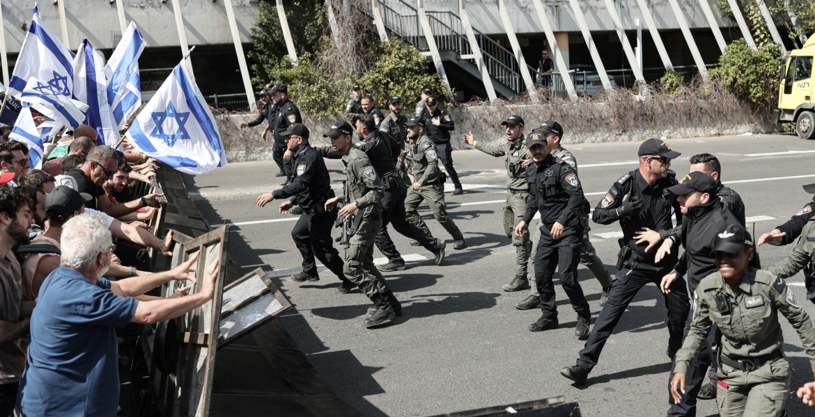 Israeli demonstrators scuffle with police during a protest against the government's planned overhaul of the legal system.