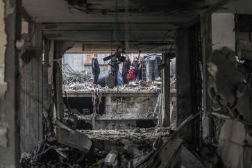 People assess the damage caused by Israeli bombardment in Rafah in the southern Gaza Strip on February 9, 2024, as battles continue between Israel and the Palestinian Hamas movement. (Photo by Mahmud Hams / AFP)